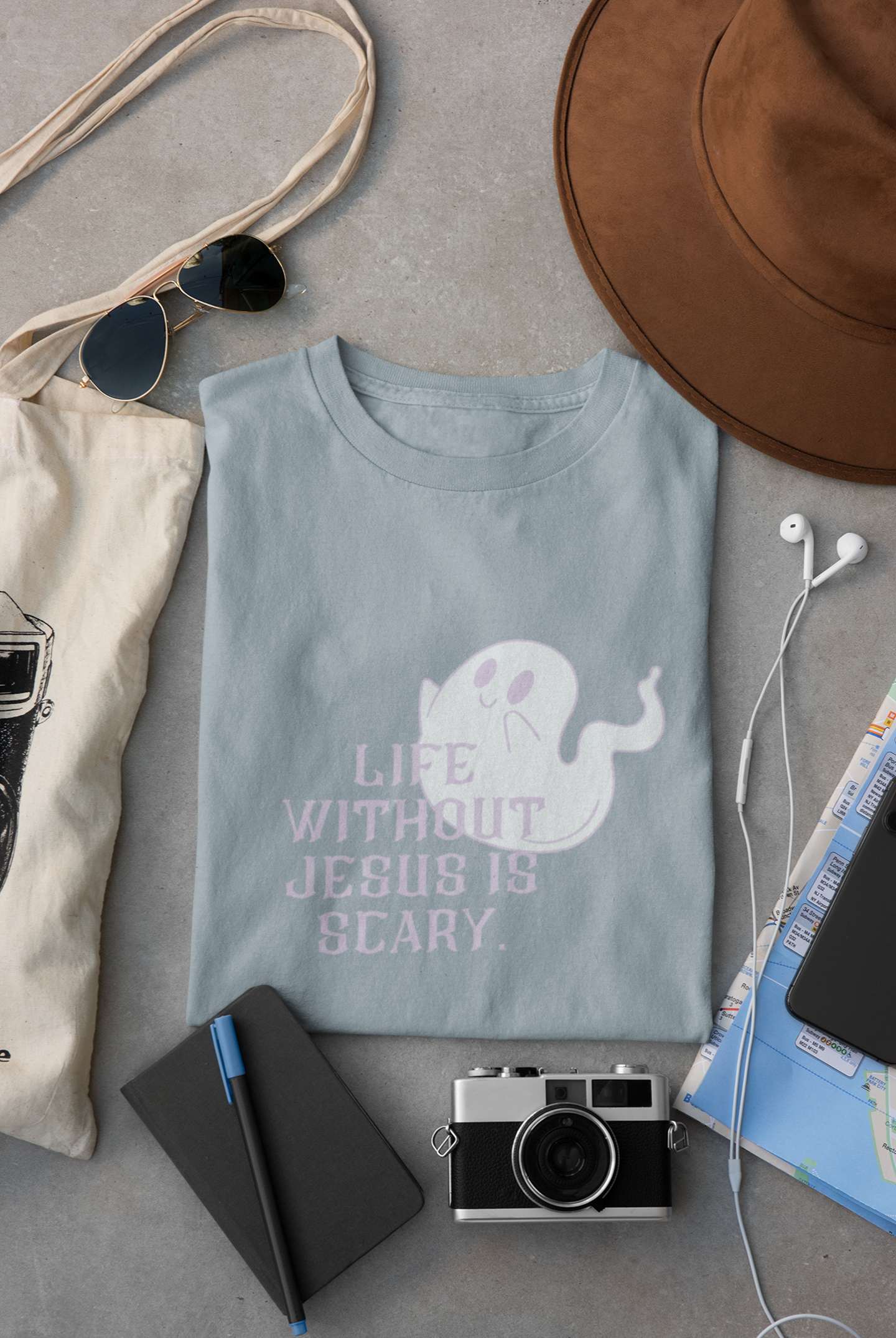 light blue tshirt with a cute ghost that reads, "life without Jesus is scary." Im a cute but spooky-ish font.